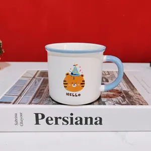 Cute cartoon tiger ceramic mug with blue rim and handle, perfect for birthday gifts.