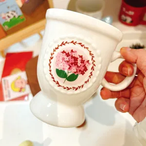 Exquisite ceramic coffee mug with floral pattern, elegant afternoon tea cup for home use.