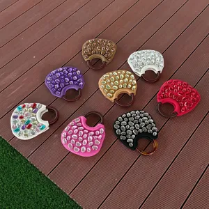 Close-up detail showcasing multiple colors of stylish stone-embellished handbag variants.