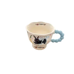 Creative cute ceramic mug with high foot, pastel blue bubble handle, and sweet rabbit print.