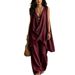 Stylish women's sleeveless drape top and wide leg pants set, casual summer beach outfit.