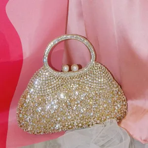 Sac de soirée scintillant en strass avec poignée ronde et fermoir perle pour fête.