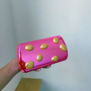 Metallische rosa Clutch Tasche mit erhabenen goldenen Punkten, stilvolle Abendtasche.