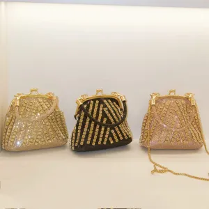 Exquisite rhinestone evening bag with elegant metal frame and sparkling crystal details.