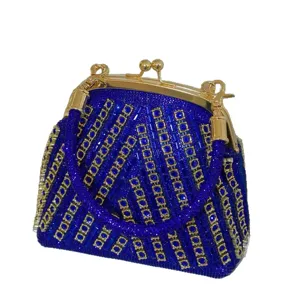 Elegant royal blue rhinestone evening bag with gold hardware, chic crystal clutch for women.