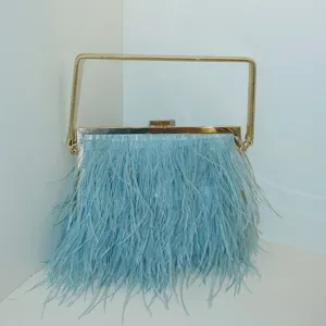 Elegant light blue feather evening bag with a chic gold metal frame handle design.
