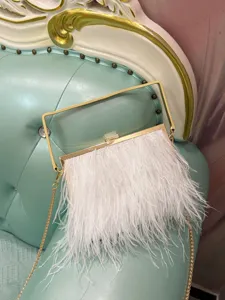 Elegant white feather evening bag with gold metal handle and chain strap for women party.