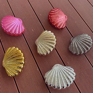 Acrylic shell evening bag detail view, displaying vibrant candy colors and glossy finish.