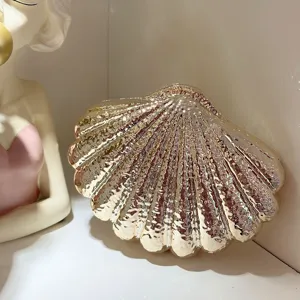 Gold acrylic shell evening bag clutch purse luxury aesthetic chic party accessory detail shot