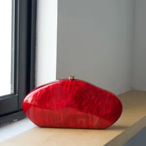 Red marble acrylic evening clutch bag, irregular shape hard shell handbag with metal clasp.