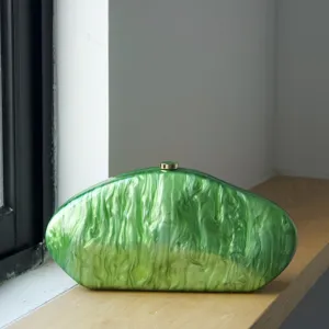 Green acrylic marble texture clutch bag detail view, elegant evening handbag for women.