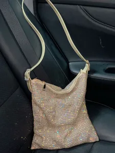 Sparkling rhinestone shoulder bag detail view, glowing crystal texture and stylish strap design.
