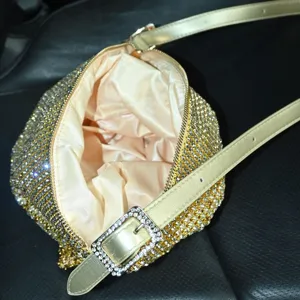 Sparkly rhinestone shoulder bag with metallic buckle and strap, elegant evening underarm bag.