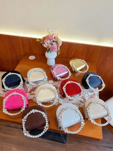 Crystal round handle evening bag detail showcasing multiple vibrant colors, satin and glitter variants.