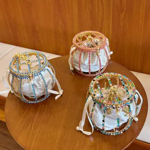 Rhinestone cage bucket evening bag with velvet inner pouch and metal chain for women.