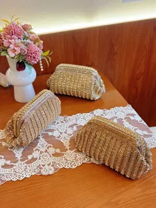Glittering rhinestone clutch bag detail, sparkling evening party crystal purse for women.