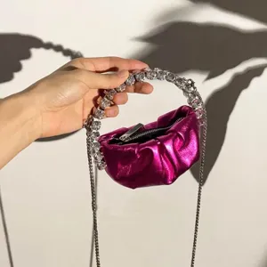 Mini metallic pink pleated evening bag with sparkling crystal beaded top handle and chain strap.