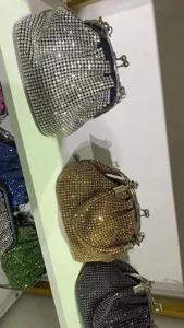 Details view of sparkling rhinestone shell evening clutch bag, mini crystal coin purse handbag.