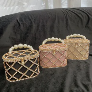 Detailed shot of sparkling rhinestone pearl handle evening bags in black, pink and champagne.