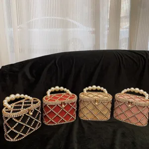Detailed view of sparkling rhinestone birdcage evening bags with pearl handles in multi colors.