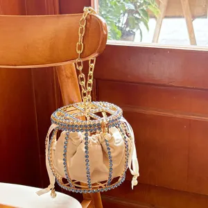 Sparkling rhinestone cage bucket bag with velvet pouch and chain handle for elegant evening party