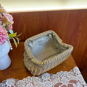 Rhinestone evening clutch bag detail, sparkling crystals, elegant dumpling shape with lining.