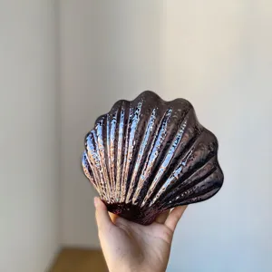 Acrylic shell evening clutch bag with metallic glossy finish, elegant party handbag details.