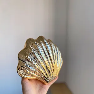 Gold metallic shell acrylic evening clutch bag, glossy shell shaped shoulder party bag.