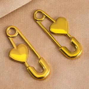 Stainless steel heart safety pin jewelry accessory detail shot, perfect for DIY crafting.
