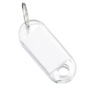 Clear plastic key tag detail shot, transparent hotel number label with metal split ring.
