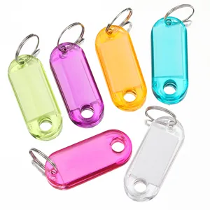 Colorful transparent plastic key tags set with split rings for hotel number and luggage classification.