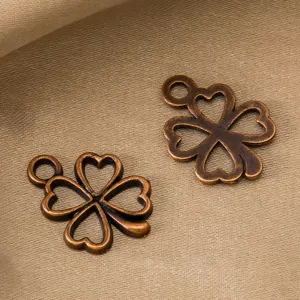 Retro bronze alloy four leaf clover pendant charms for DIY jewelry making and craft supplies.