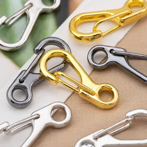 Detailed close-up of mini zinc alloy spring hooks in gold, silver and gunmetal finishes.
