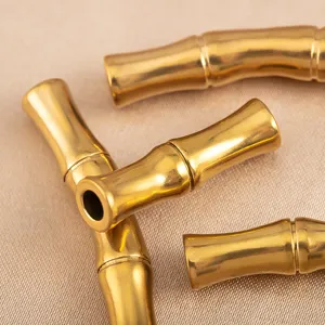 Gold stainless steel bamboo curved tube DIY jewelry spacer beads detailed macro shot.