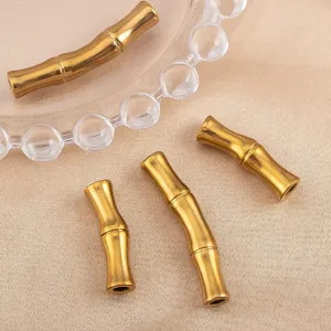 Close-up of 18K gold plated stainless steel bamboo shaped curved tube beads for DIY jewelry making.