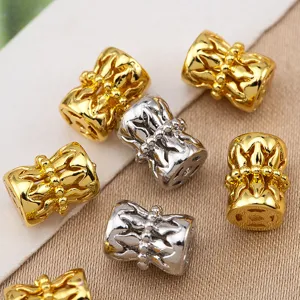 Detailed shot of copper hollow flower drum beads, spacer beads for DIY jewelry making.