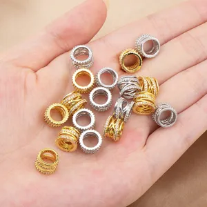 Detail view of copper micro-paved cubic zirconia barrel spacer beads for DIY jewelry making.