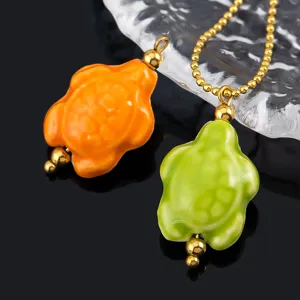 Detailed view of marine series ceramic turtle stainless steel gold plated pendant DIY jewelry accessory