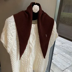 Detailed view of the Korean style soft knit triangular scarf, cozy autumn neck warmer shawl.