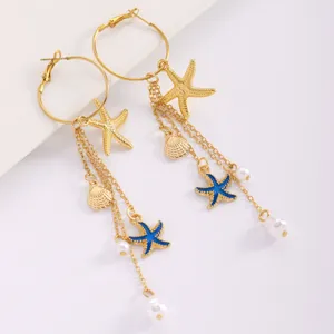 Gold starfish pearl tassel earrings for women, stylish beach vacation seashell drop jewelry.
