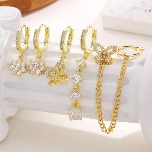Gold crystal huggie earrings set featuring cute butterfly and flower designs for women.