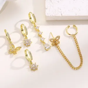 Detailed view of trendy gold butterfly and floral rhinestone ear piercing set for women