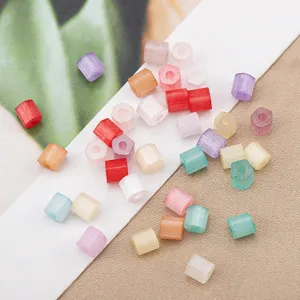 Close-up detail of colorful macaron hexagonal glass seed beads for DIY jewelry making crafts.