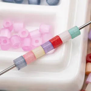 Macaron colored glass tube beads DIY craft material detail closeup view for jewelry making