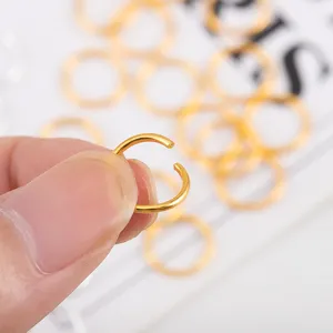 Gold open jump rings detail shot, DIY handmade jewelry making accessories and connectors.