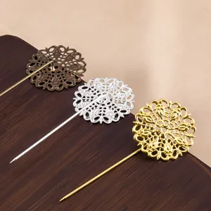 Detailed view of exquisite bronze, silver, and gold filigree lace hair pins and brooch accessories.