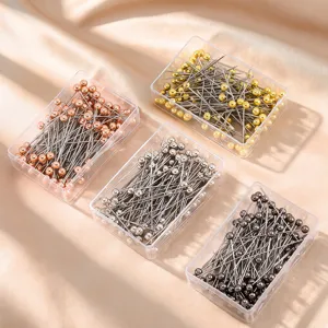Stainless steel pearl head pins in four metallic colors, ideal for DIY sewing and crafting.