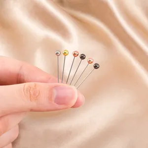 Close-up view of colorful ball head pins for sewing and DIY jewelry craft design accessories
