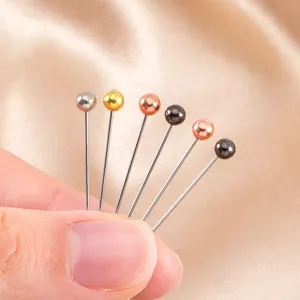 Stainless steel head pins detail shot, colorful round ball positioning pins for DIY crafts and sewing.