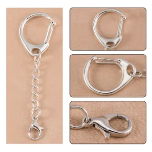 Silver metal keychain detail, D-ring and lobster clasp closeup for DIY jewelry crafts.